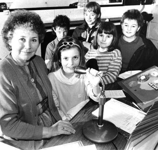 Molly shows a school group how to do a station announcement.