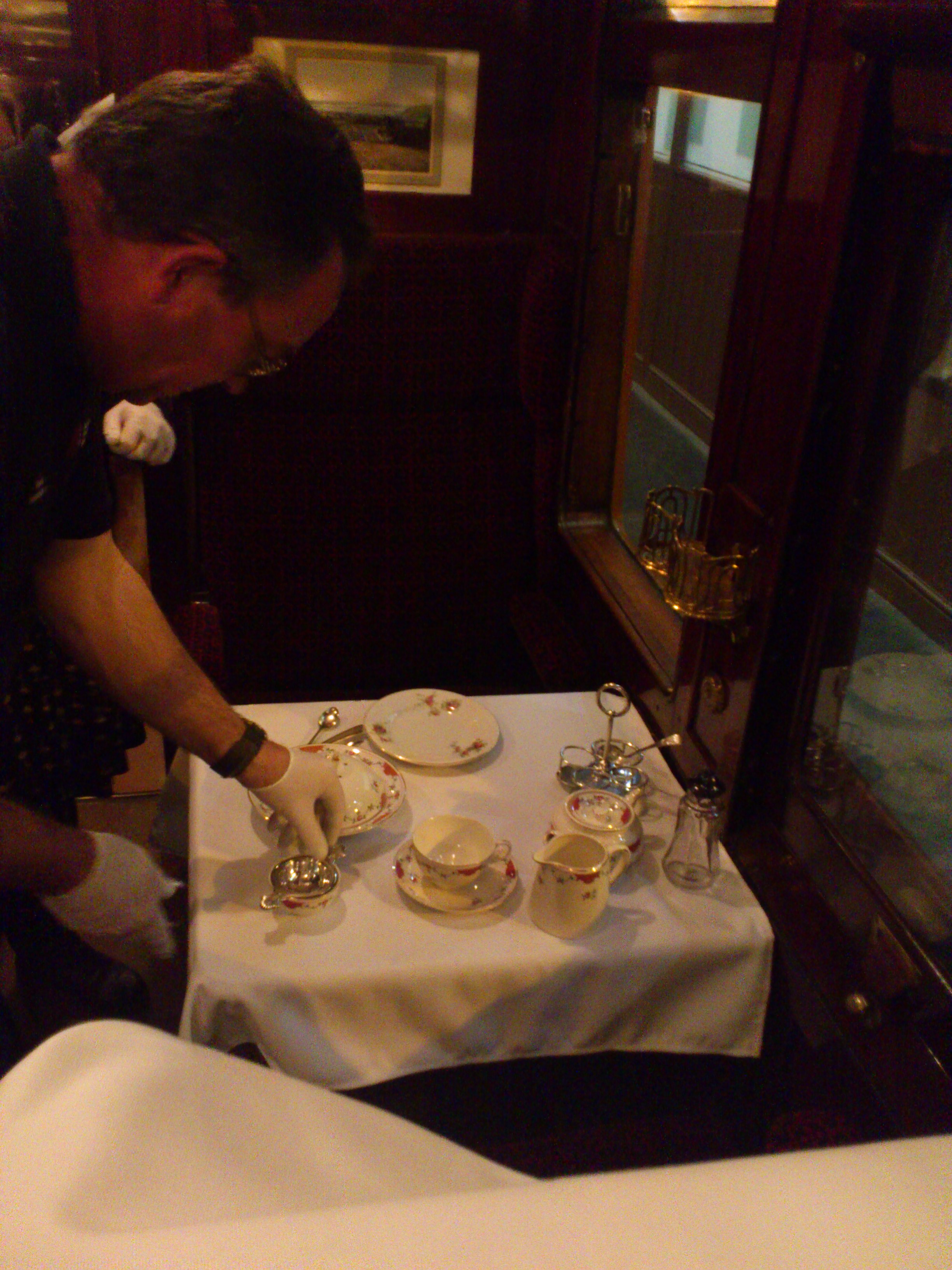On Thursday we started to add some collection items to the displays. Here, Chris is setting one of the tables in our Midland Railway dining carriage.