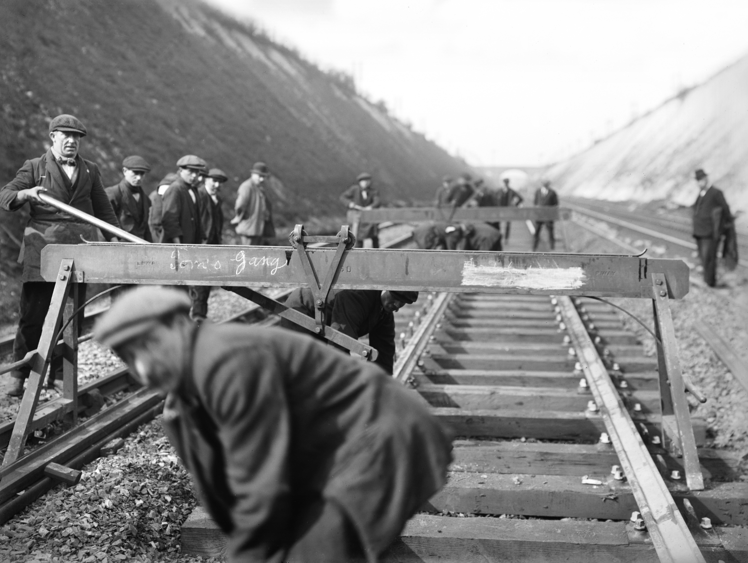 Permanent way workers laying new rail, 1923. 