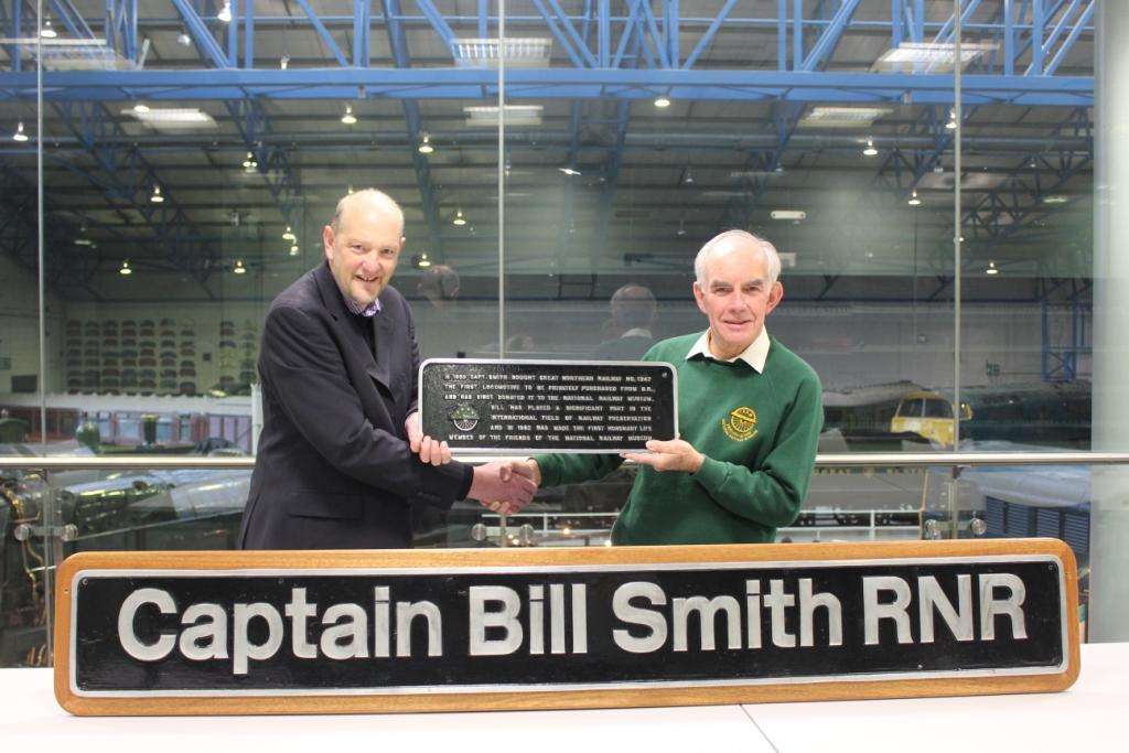 Dr Ian Harrison, Chairman of the South of England Group of the Friends of the National Railway Museum, passes the nameplates to Russell Hollowood, Assistant Curator of Railways.