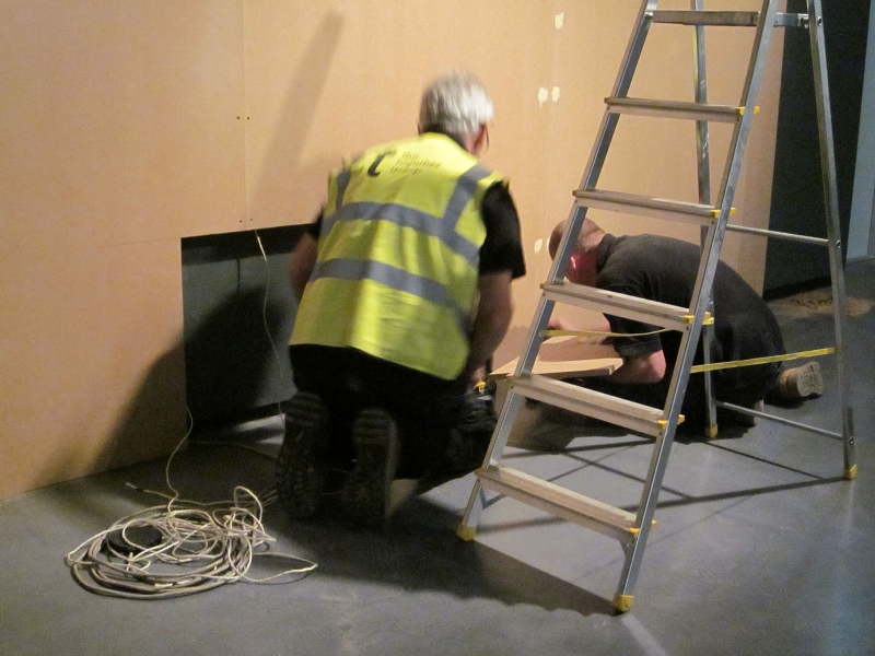 Rob and Pete from The Together Group finish the projector screen wall