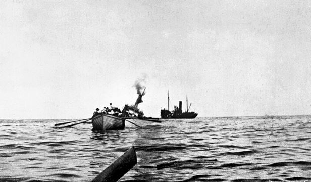 The Aragon sinking. In the foreground is one of the lifeboats. © IWM (SP 2054)