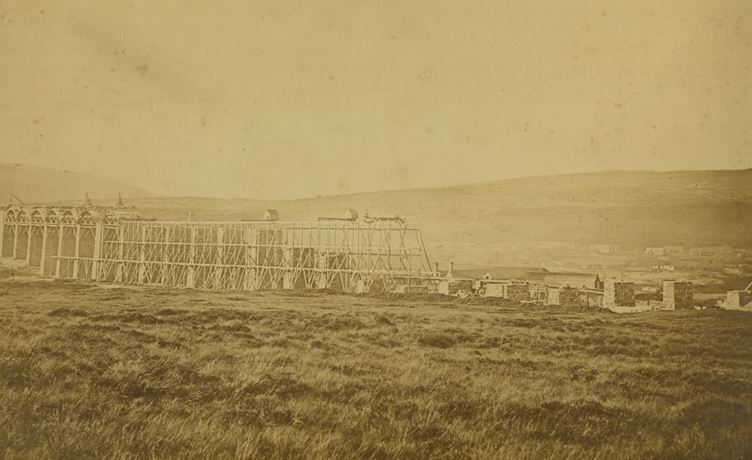 The Ribblehead Viaduct under construction – the settlement buildings can faintly be seen in the background to the right of the picture. National Railway Museum Collection.