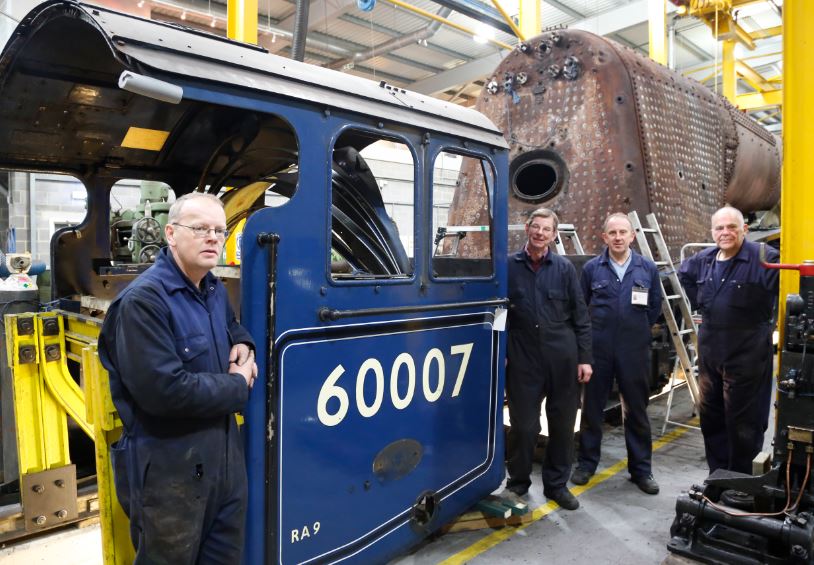 Darrin (left) with some of the Sir Nigel Gresley Locomotive Trust volunteers helping to overhaul the engine.