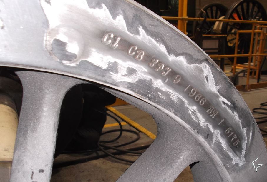 An example of the historical markings on the wheelsets revealed after removing the paint.