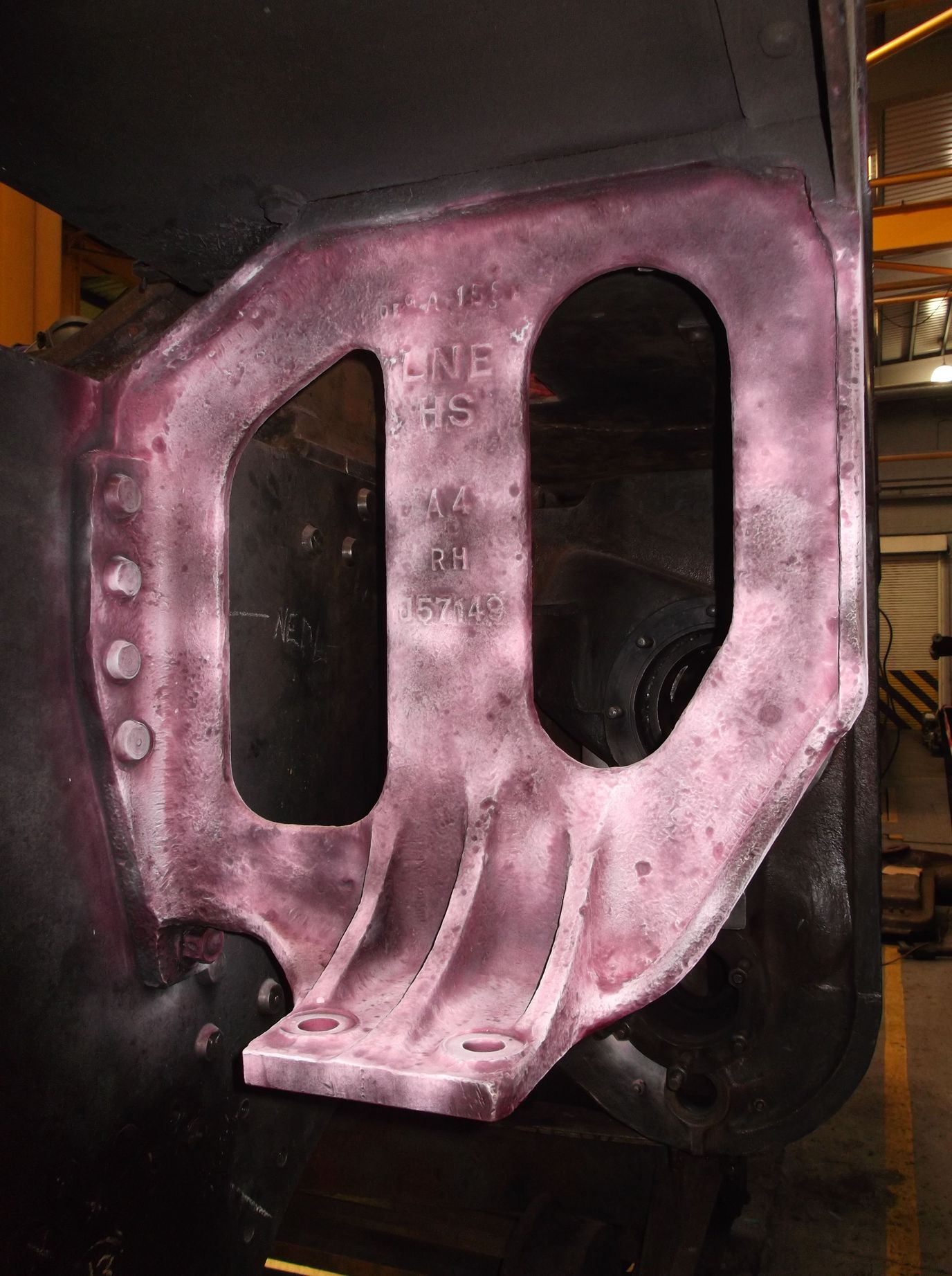 Using dye penetrant fluids on the loco brackets to test for flaws leaves the inspected areas pink. This is the right hand slidebar bracket.