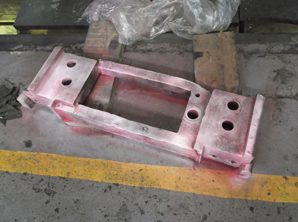The trailing right coupled wheel hornstay. It has been thoroughly cleaned and sprayed with dye penetrant fluids to show up any surface defects.