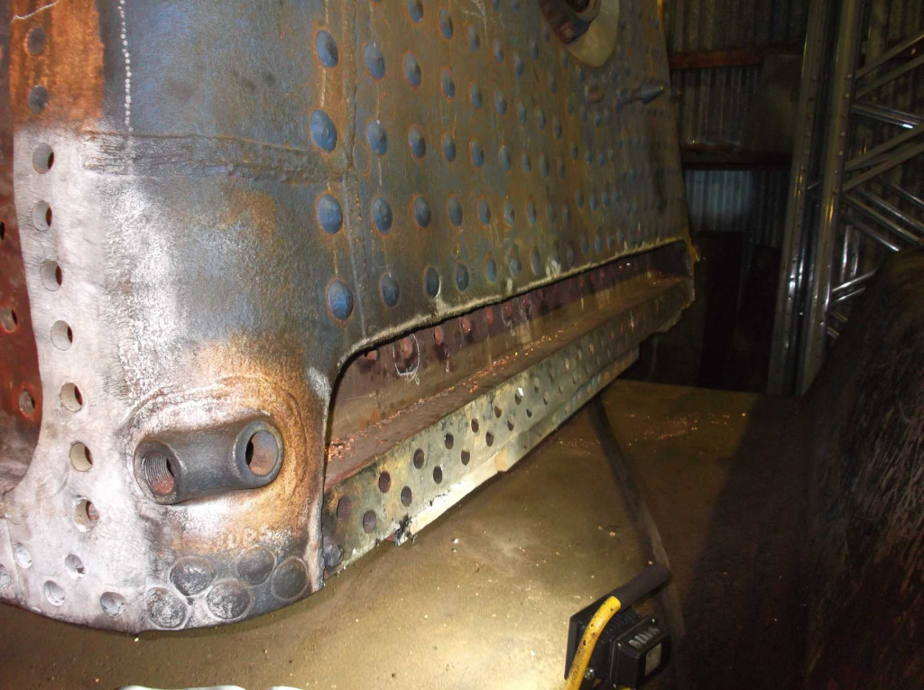 A view across the back of the boiler with plate removed exposing the foundation ring