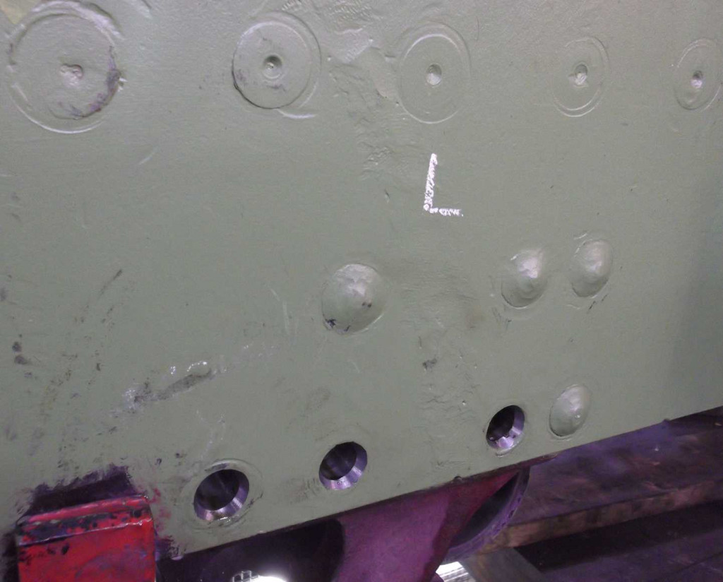 Spring bracket holes finished, reamed and countersunk ready to receive new rivets