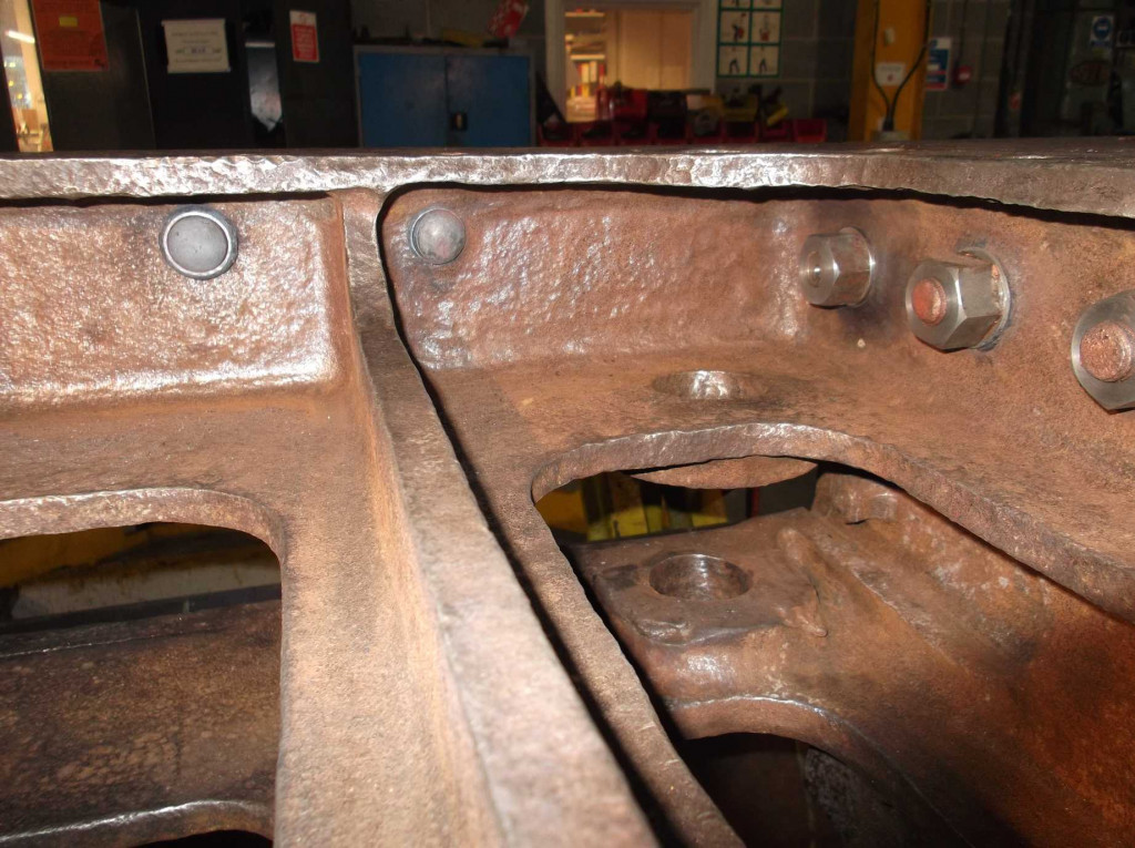 The inside of the dragbox on the driver's side. The two new rivets put in last week can be seen. The furthest nut is on the bolt shown being jacked in on another photo with this report. New nuts have been put on the old fitted bolts to protect them from corrosion.
