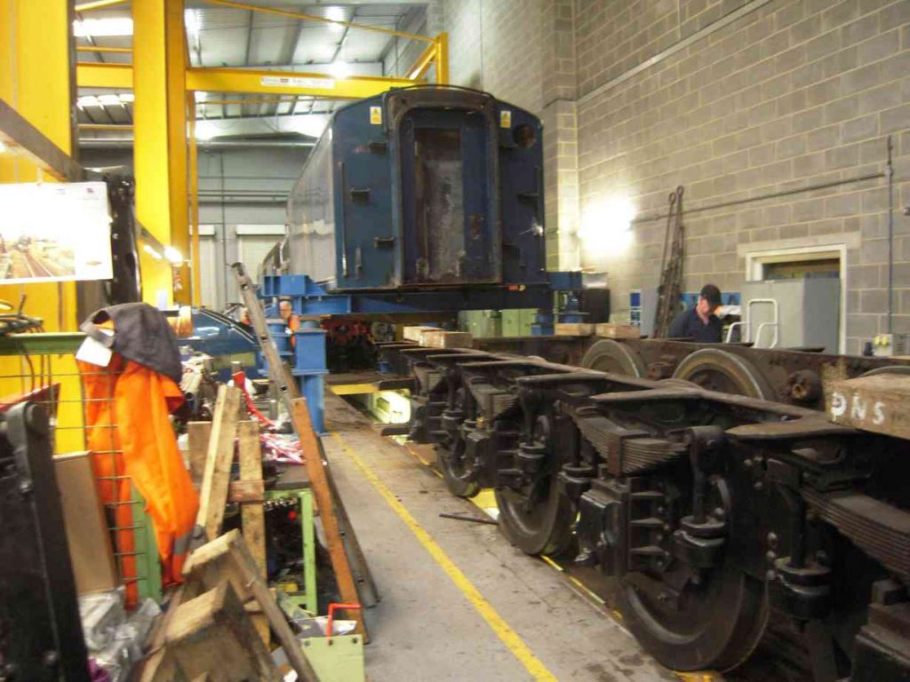 Locomotive frames rolled out from underneath the tank.