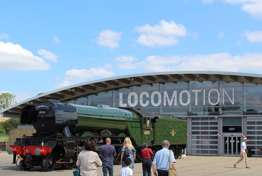 Locomotive Flying Scotsman outside the collection building on a bright sunny day