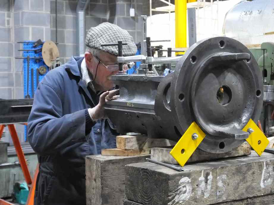 The new valve guide casting is carefully positioned