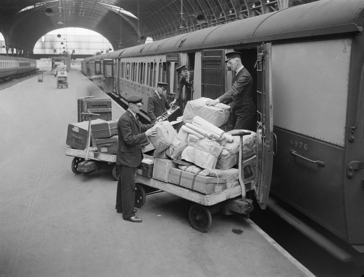 Loading luggage and parcels into a railway carriage, 1940.