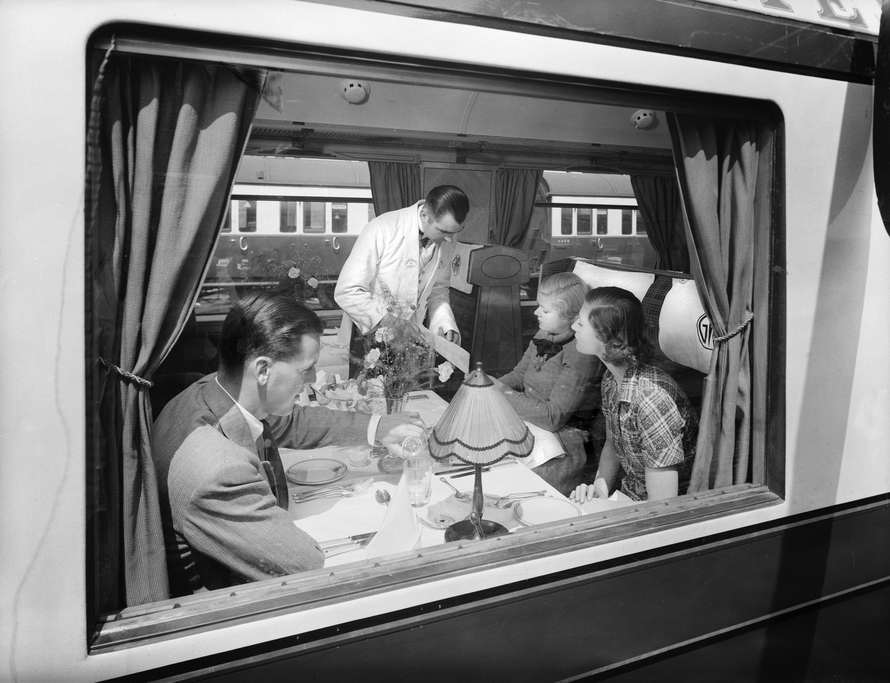 Waiter service in a first class Great Western railway dining car, 1938