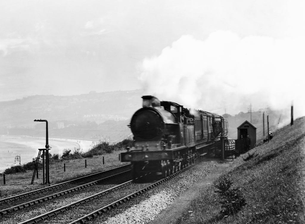 TPO picking up a mail pouch at Colwyn Bay, 1909. Post could be collected and sorted on the move. National Railway Museum / SSPL