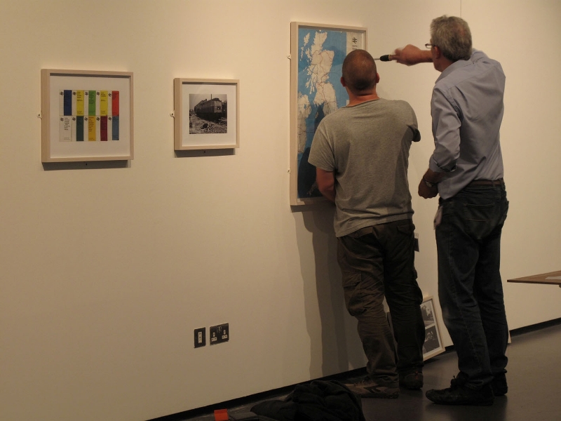 Andy and Rob hang Andrew Cross’s map of Great Britain