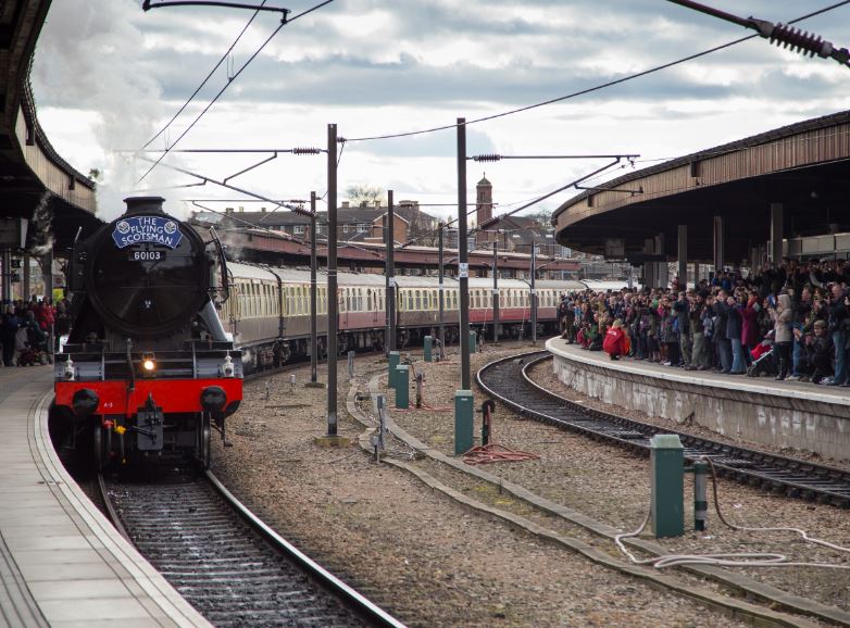 Arriving into York station, only slightly later than schedule due to some over enthusiastic spectators .