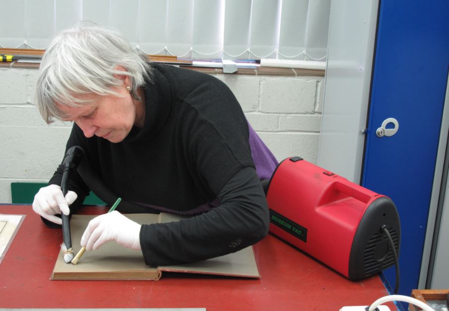 Ruth treating the books for mould damage