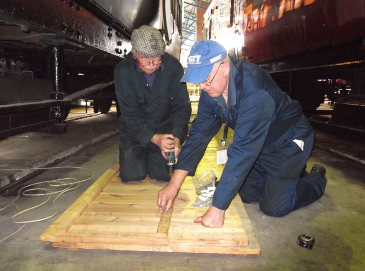 Bob Shearman and Alan Pitt making the last racking shelf