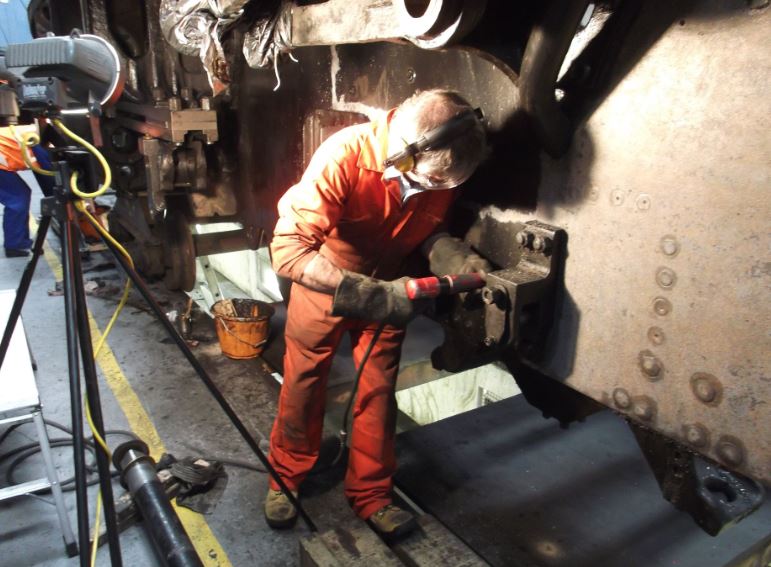 Martin Ashburner needle gunning the left hand outside frames