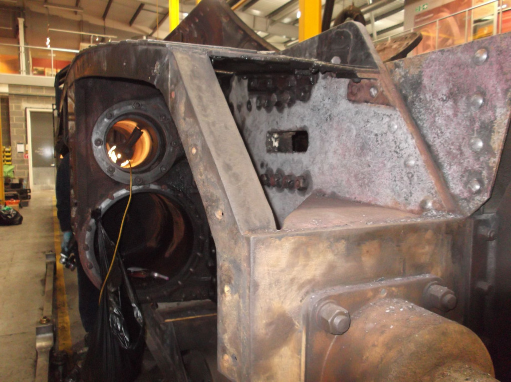 The outside steam chests have been de-carboned and cleaned. Bob Shearman cleans the right hand