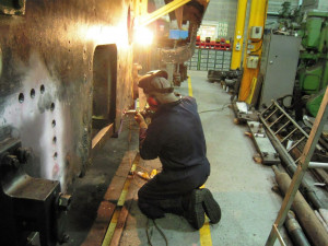 Mike Page cleans up the rivet hole countersinks.
