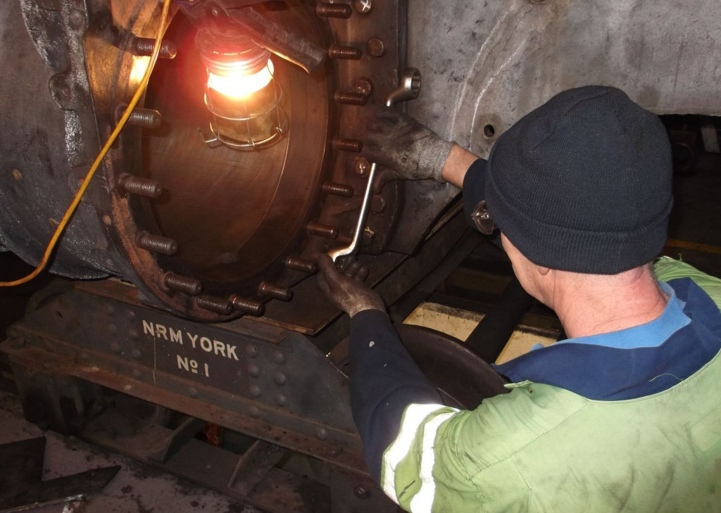 On his first day with us, Phil Slater cleans the threads of the left hand drain cock bracket studs.