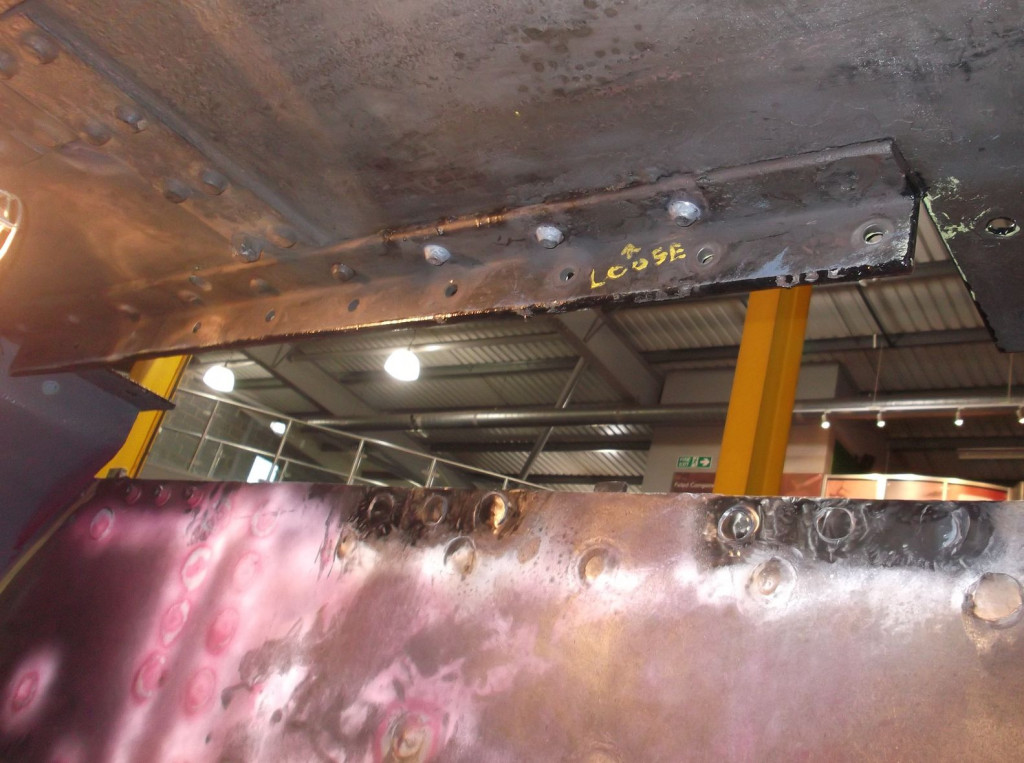 A view where the right leading coupled wheel is normally located showing new rivets in the frame and in the long angle under the footplating.