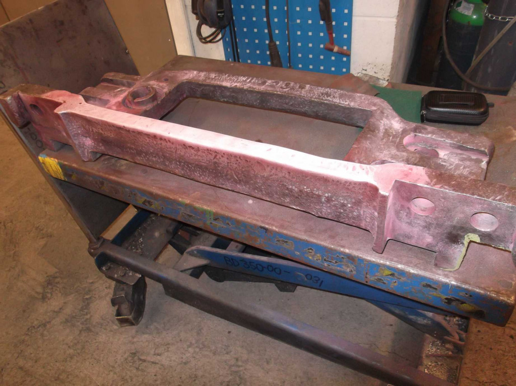 The leading right hornstay. The bright edge nearest has been dressed to remove decades of impact damage from fitters removing and refitting the hornstay to the frames. With a clean smooth, surface a reliable examination can take place and the danger of future cracking is reduced