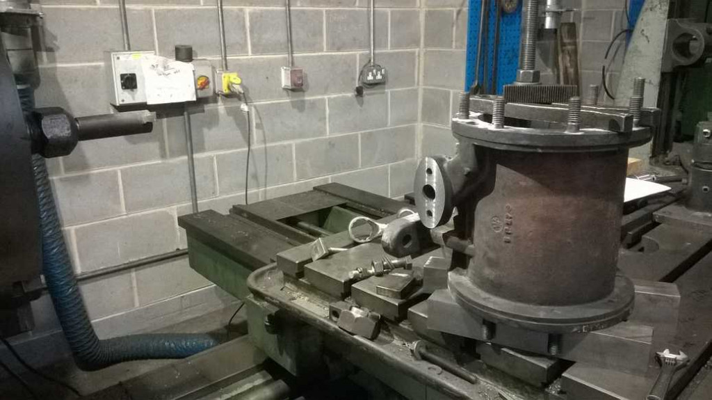 The steam cylinder of the air pump has had the steam connection flange refaced on the NRM's "Union" horizontal borer.