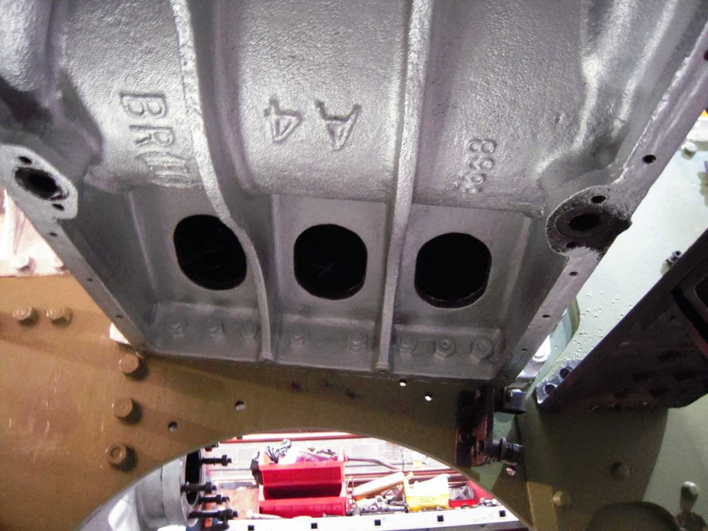 Underneath the middle cylinder casting, during priming, the cast-in markings are now clearly seen.