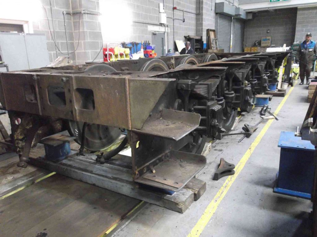 The tender frames of locomotive Sir Nigel Gresley in the workshop.
