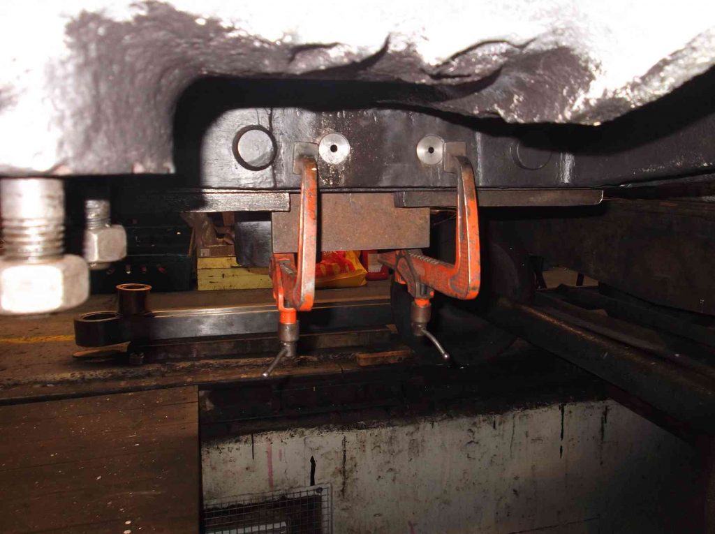 Bogie sidebearer plates clamped in place.