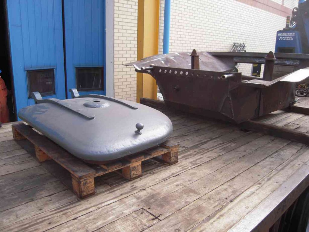 The ashpan and smokebox door loaded onto road transport.