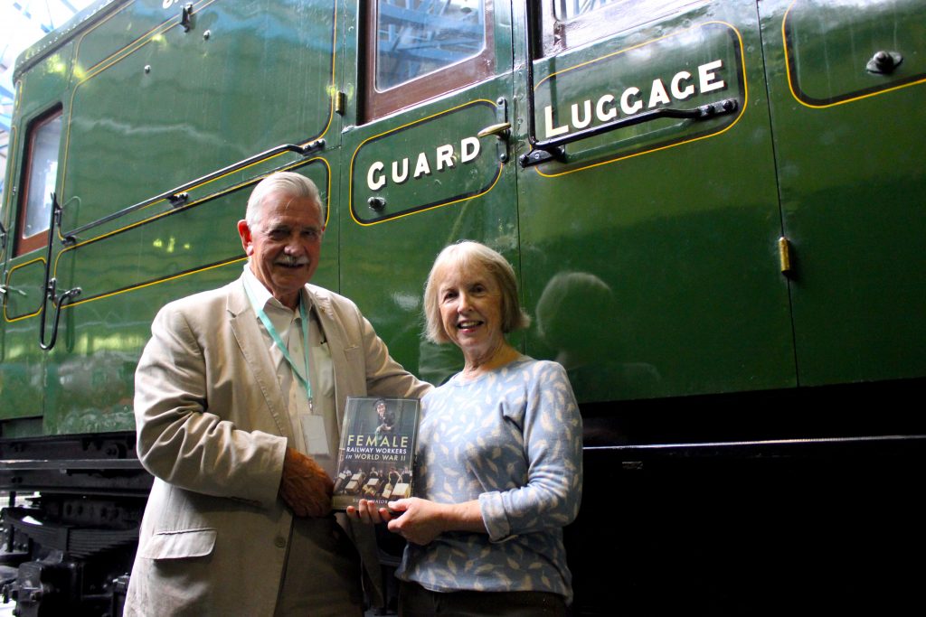 Susan and Frank Paterson standing in front of a carriage