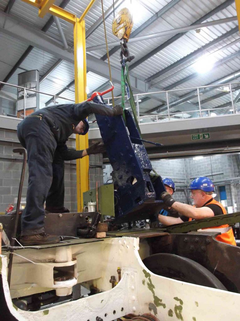 The overhauled reverser is lowered on to the cab floor plate