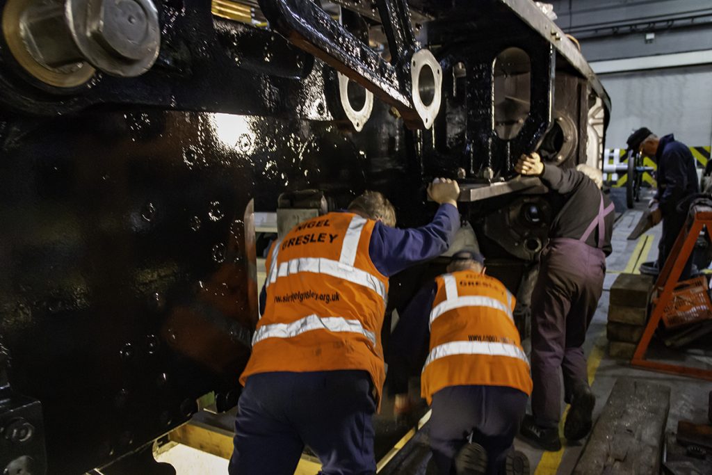 The loco chassis is heaved forward in to position