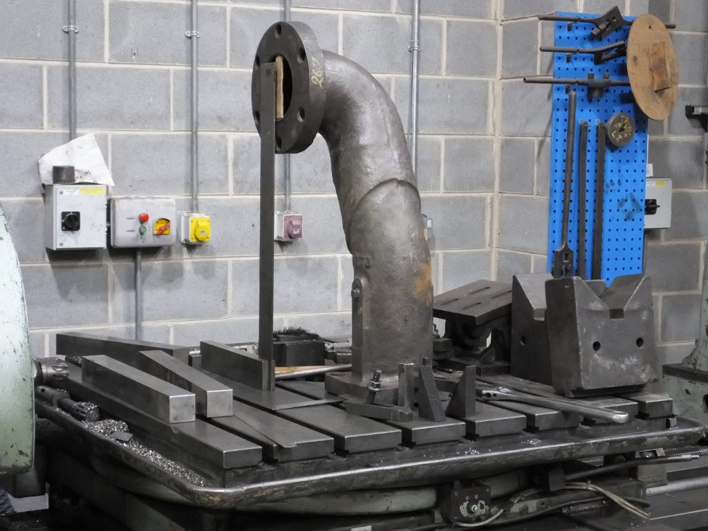 Measuring the cast iron steam pipes