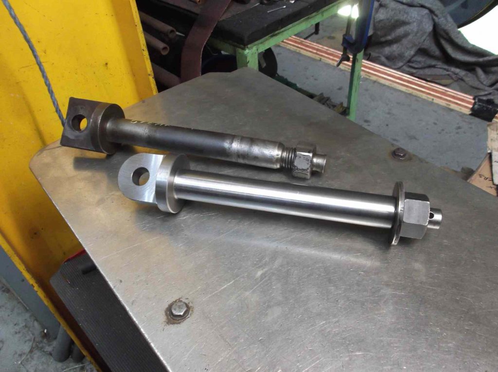 The new tender lower brake hanger pin next to the old