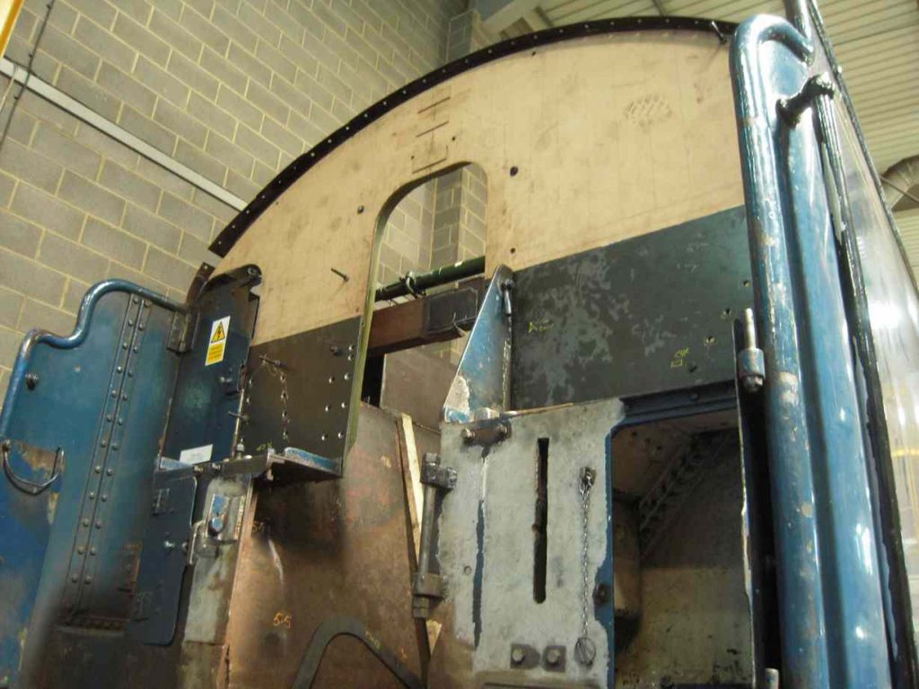 A wooden pattern in place on the front of the tender