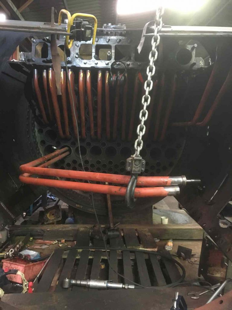 Superheater elements have their ends pre-expanded