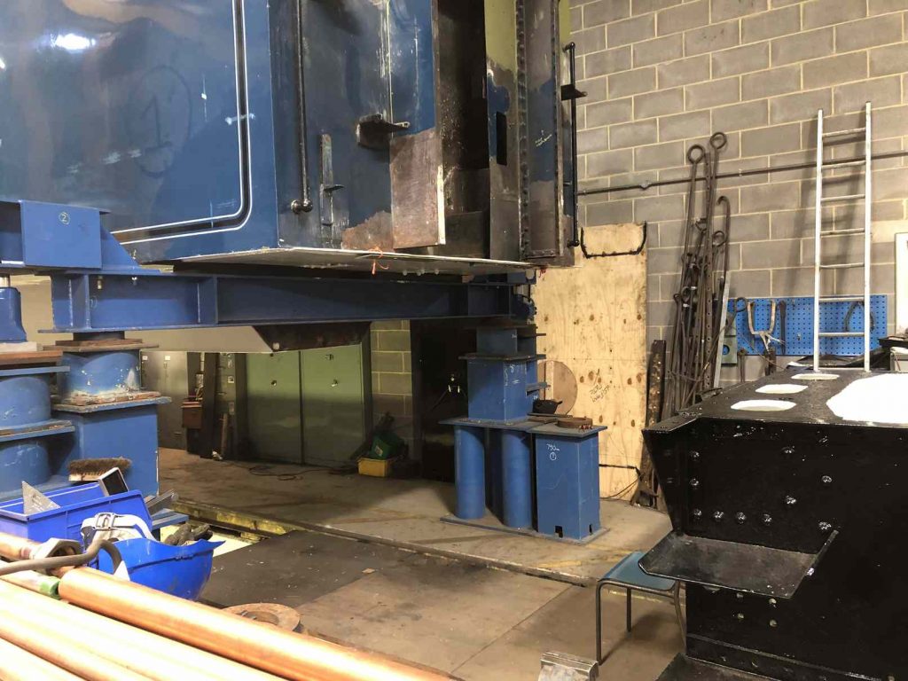 The tender tank being lifted to clear the height of the frames