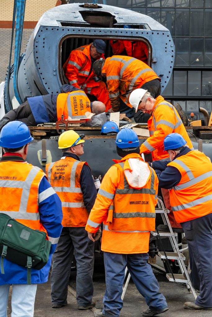 Securing bolts are put through smokebox saddle