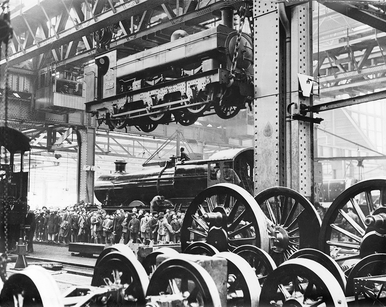 Great Western Railway 0-6-0 locomotive No 1269 suspended from a crane in the erecting shop at Swindon works, Wiltshire, 1926.